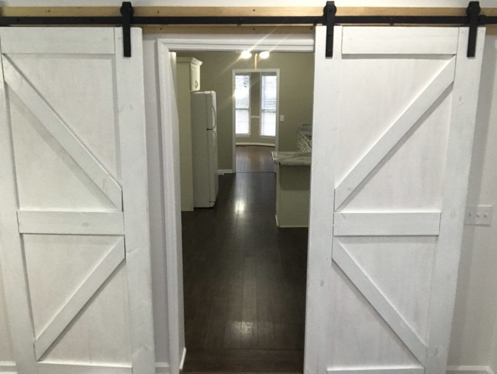 Wall-mounted sliding door with exposed track (1)